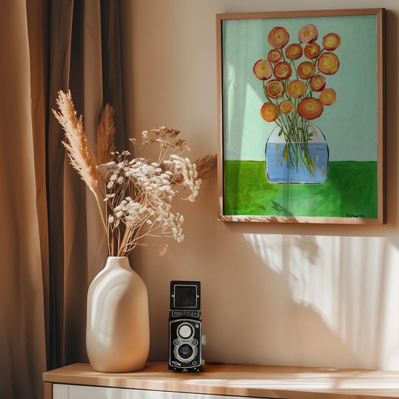 Vase with red orange flowers