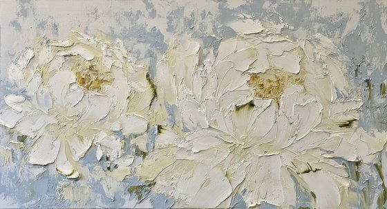 Two cream peonies on blue