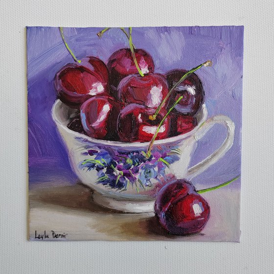 Cherries in porcelain cup