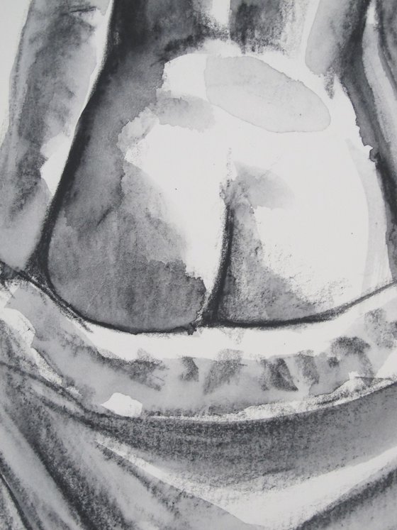 Standing female nude back view