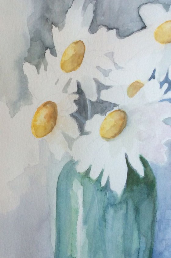 Daisies in green vase