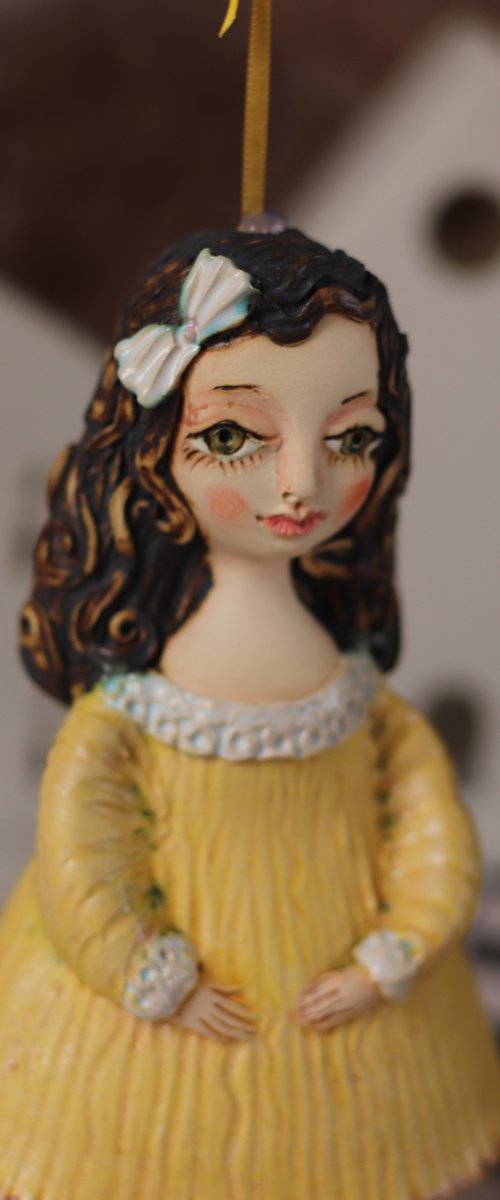 Little Girl in Yella. Hanging sculpture, bell doll by Elya Yalonetski by Elya Yalonetski