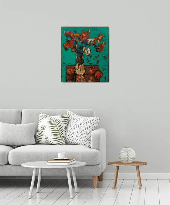 Still life with apples and flowers on a green background