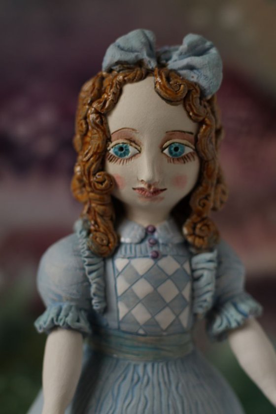 From the Alice in Wonderland. Alice as a little girl.  Wall sculpture by Elya Yalonetski