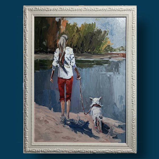 Woman walking with a dog.