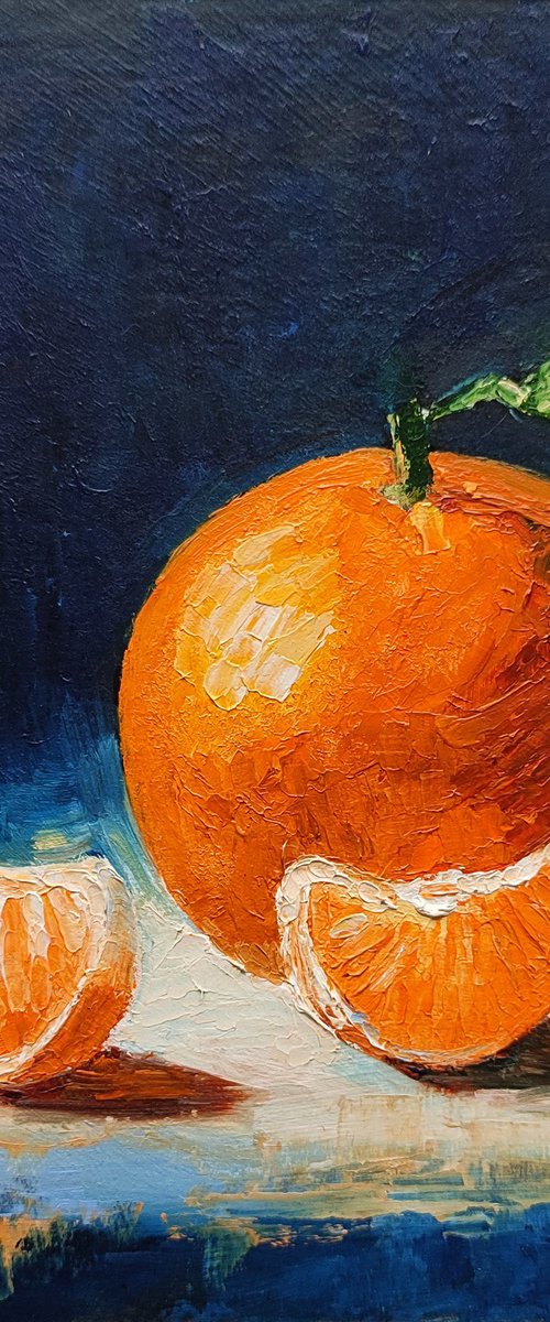 Tangerine on a dark background by Yulia Berseneva