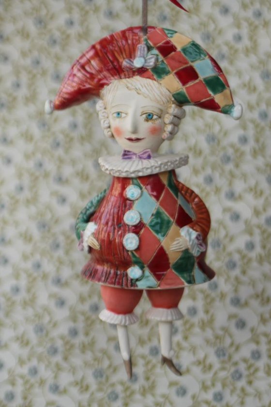 Harlequine. Sculptured bell-doll