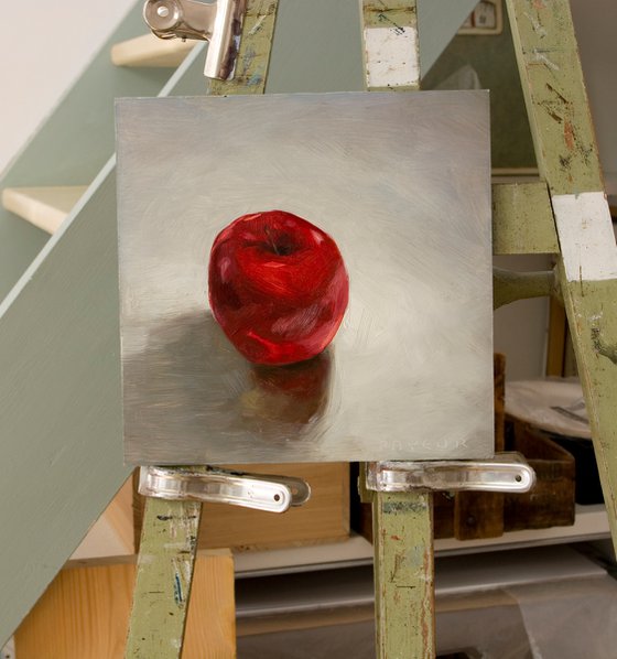 still life of red apple on a white background