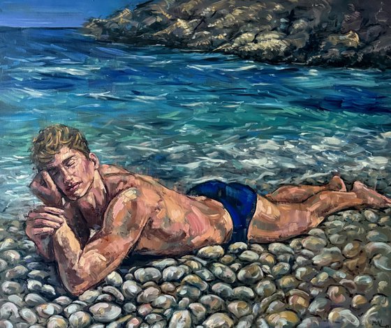 Man lying down at the beach