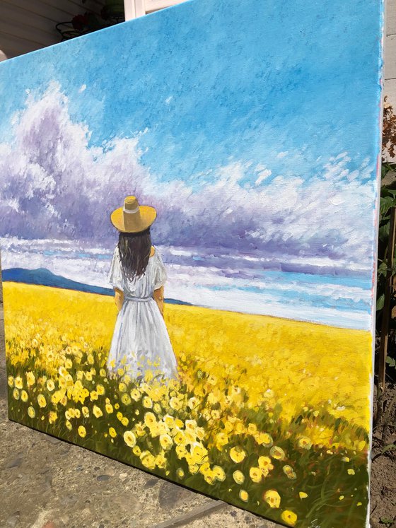 Summer. Woman in flower field