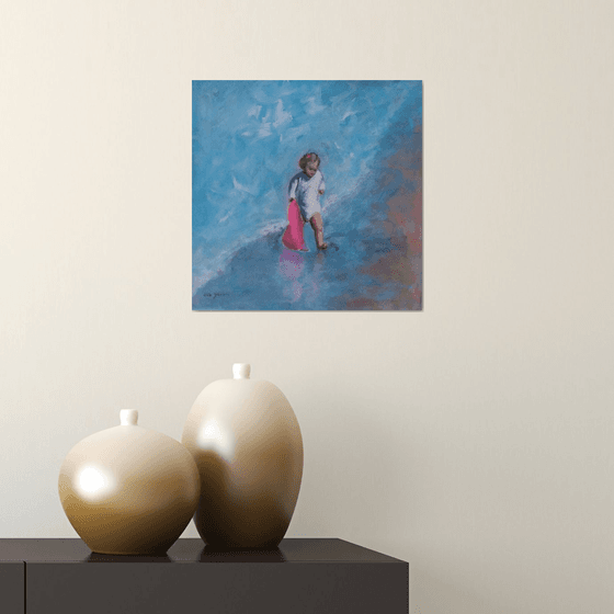 Child at the sea with towel