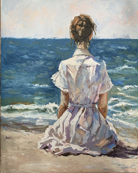 Woman by the ocean.