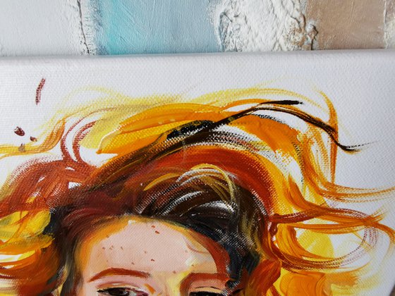 Portrait of a red-haired girl on canvas with oil paints