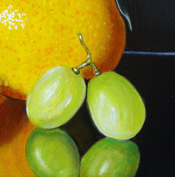 Orange with three grapes