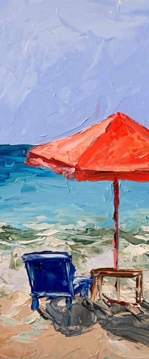 Red parasol on the beach. by Vita Schagen