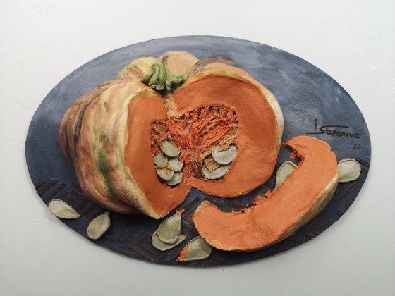 Juicy pumpkin on a dark background-a delicious bas-relief for the kitchen 13,5x20x4 cm.