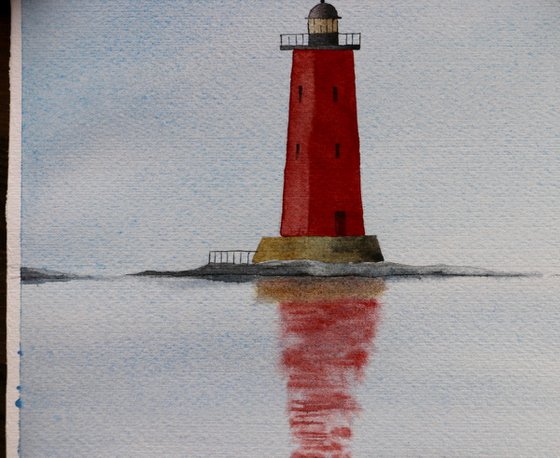 Red lighthouse in the sea.