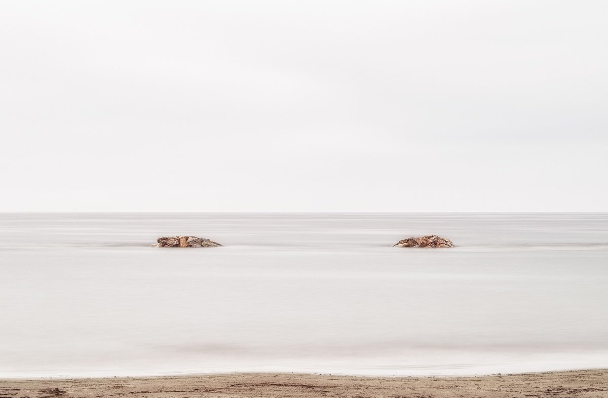 Two rocks emerging from the Tyrrhenian Sea by Karim Carella