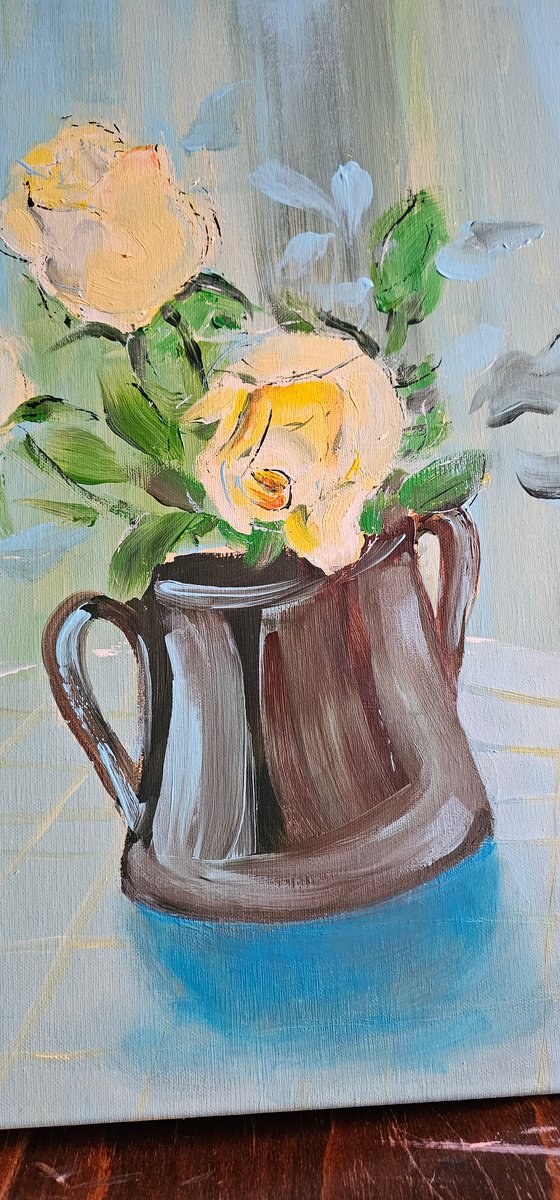 Blooming yellow roses on blue