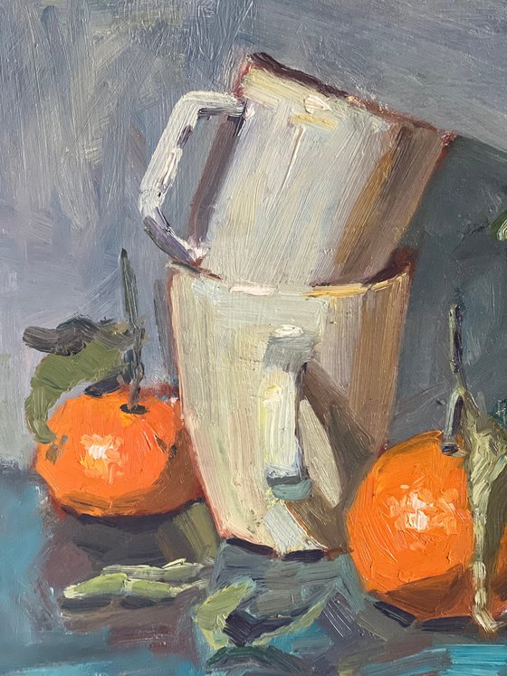 Oranges and white cups