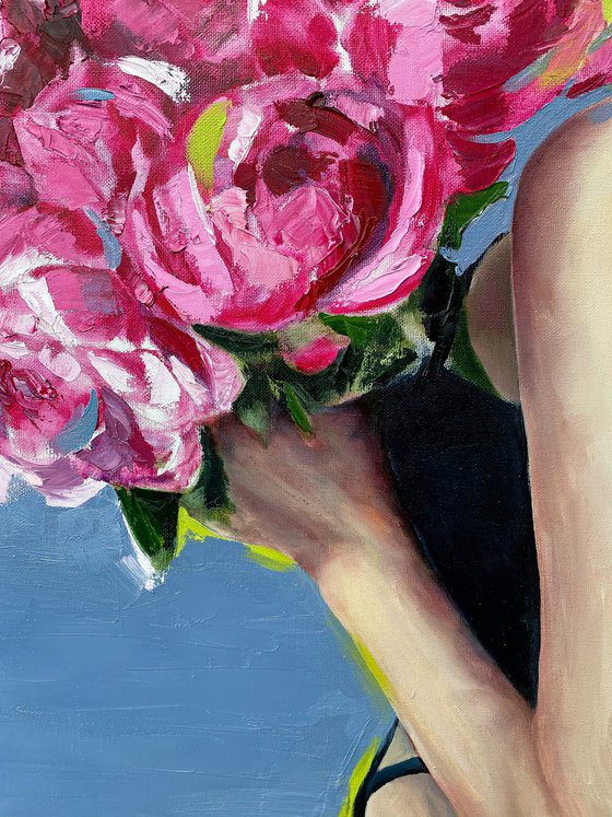 Lovely women with magenta peonies