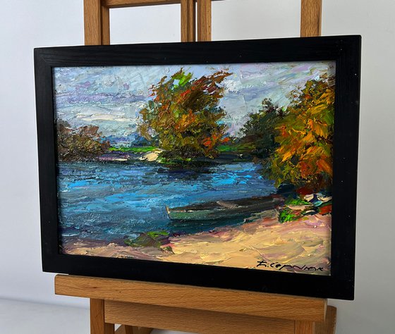 A Boat on the River Bank