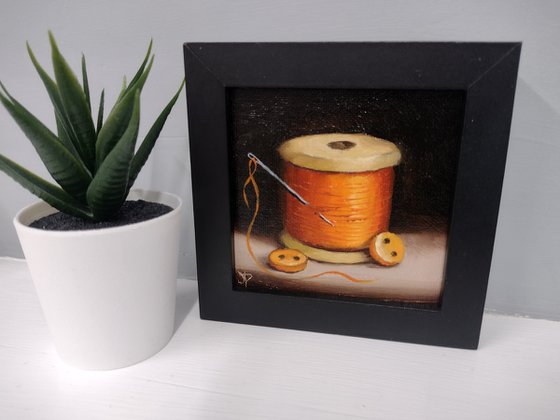 Little Orange  cotton reel  still life