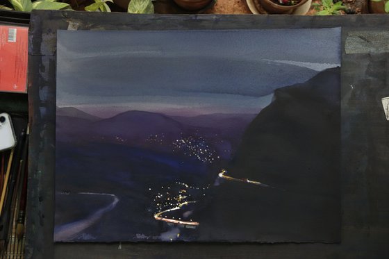 Night lights, moutain road