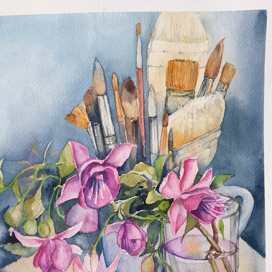 Fushia flowers on painter's table