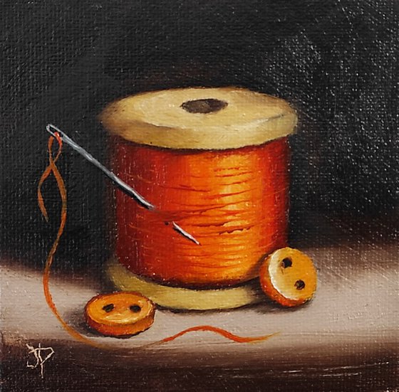 Little Orange  cotton reel  still life