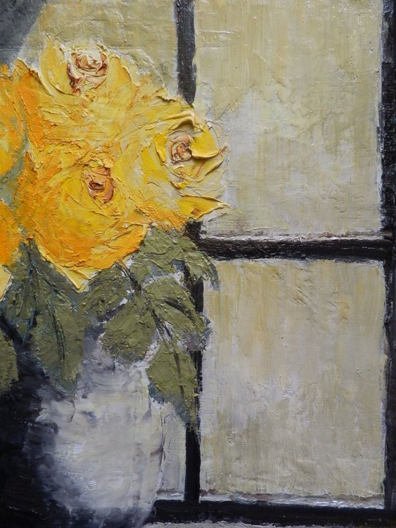 Yellow roses in a window