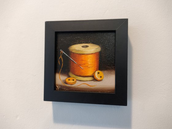 Little Orange  cotton reel  still life