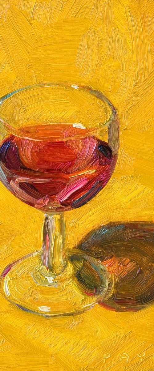 glass of red wine on yellow by Olivier Payeur