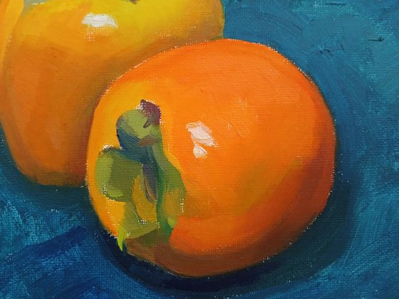 Two Persimmons on Blue Cloth