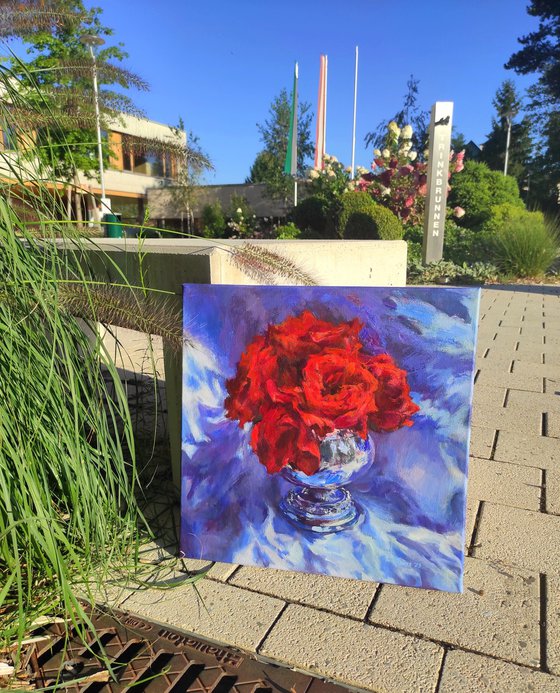Red roses in a metal vase