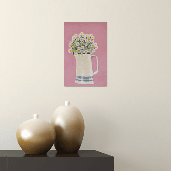 Daisies in vase on pink