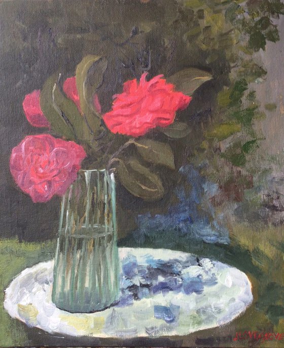 Red Camelias on a garden table. Oil painting.
