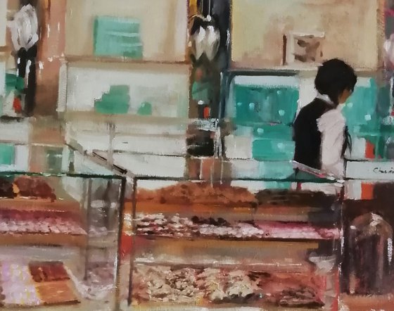 Behind the cake counter