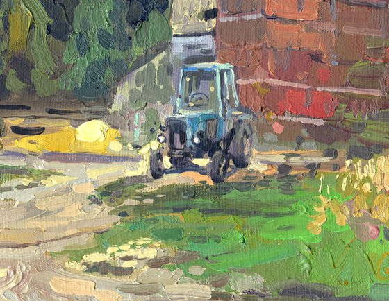 Blue tractor at the sawmill. Rodnya village