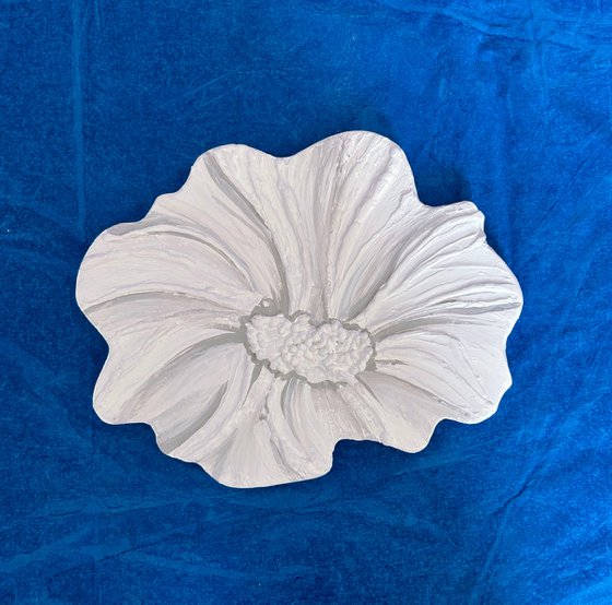 Small white sculptured  flower
