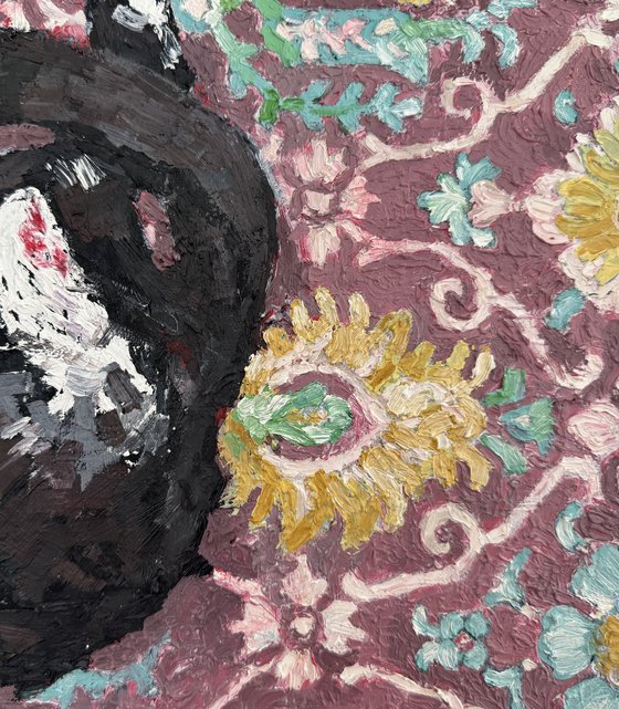 Black cat at the carpet