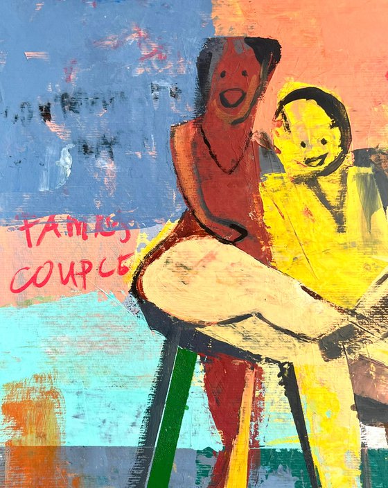 Happy Couple Sitting On A Chair