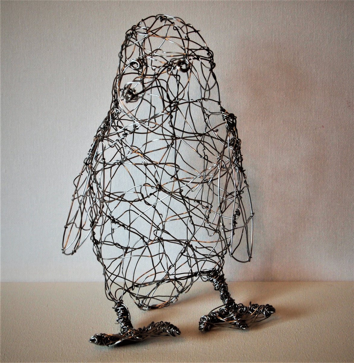 Silver wire Poppy Penguin sculpture by Steph Morgan