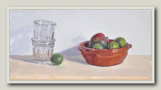 Limes and mango in an earthenware dish, jam jars