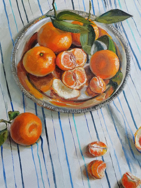 Clementines on stripen tablecloth