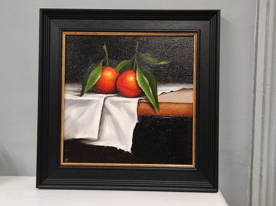 Clementines on cloth still life