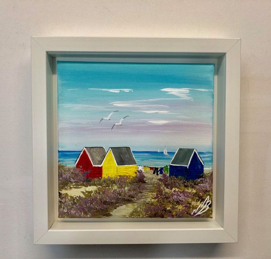 Three beach huts on the beach