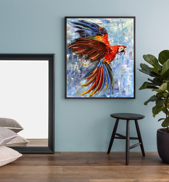 BRIGHTNESS OF FLIGHT - Red bird. Bright parrot. Ara parrot. A bird with large wings. Soaring parrot. Colorful feathers. Large beak. Lush tail. Blue background.