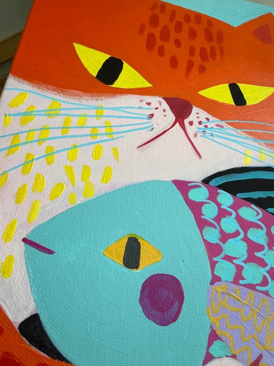 Orange Cat with Colorful Fish