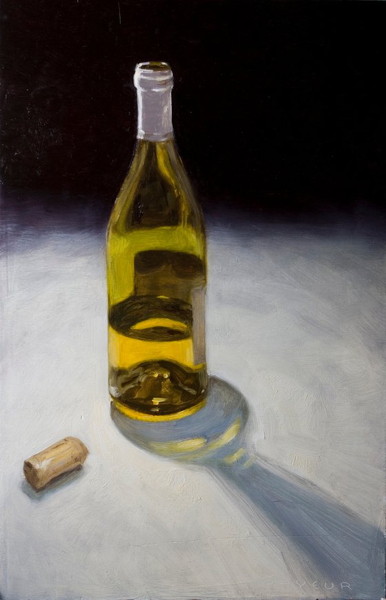 gift for drink lovers: still life of a bottle of french wine on light background